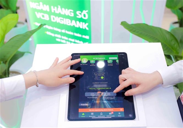 Customers use the VCB Digibank platform of Vietcombank. Banks are increasing investment in digital services to support growth. — VNA/VNS Photo